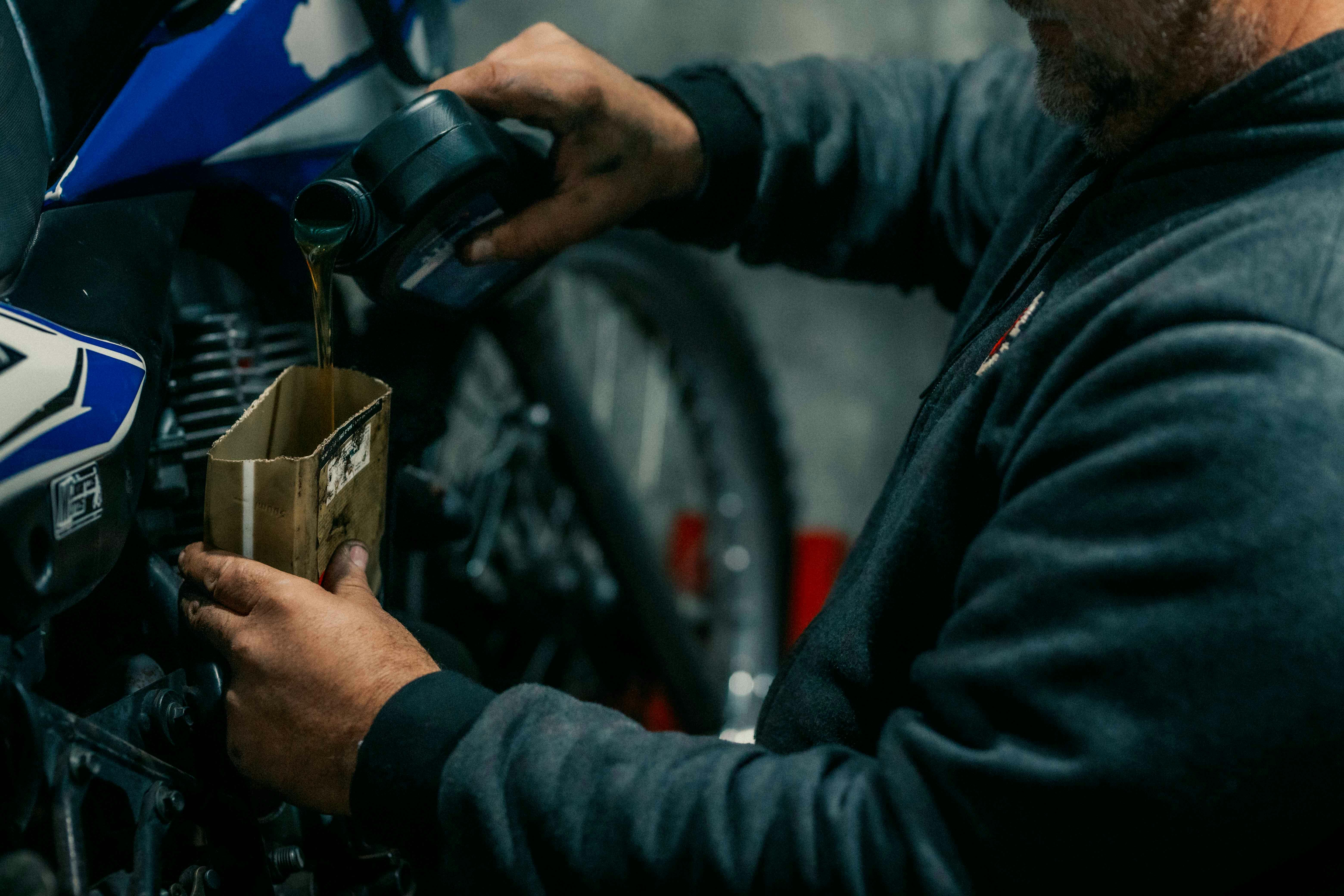 Photo by Gera Cejas: https://www.pexels.com/photo/a-man-is-working-on-a-motorcycle-27704018/